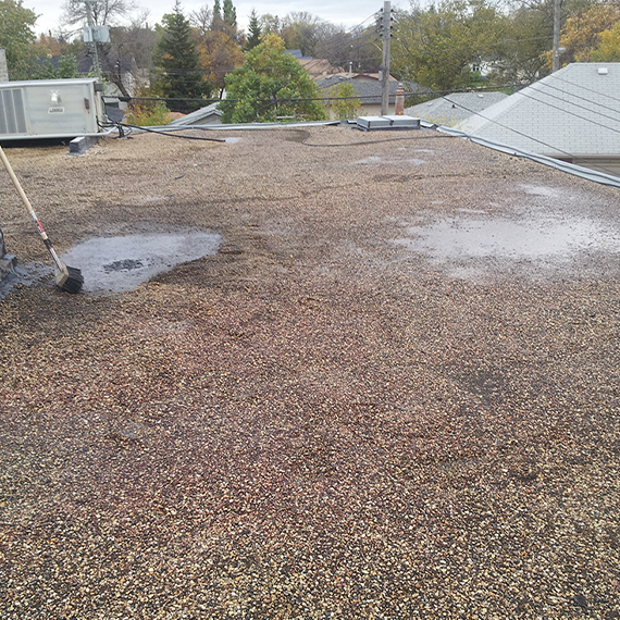 Deteriorated roofing membrane before sleeper installation
