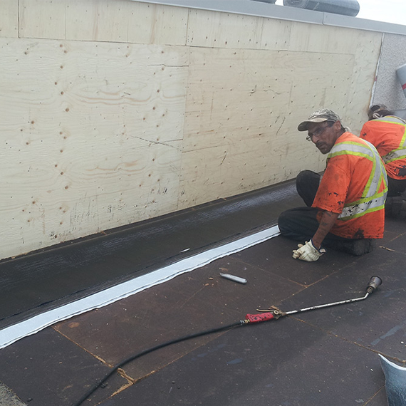 New stucco installed during roof repair