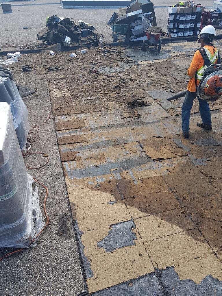 Roofing work underway during construction