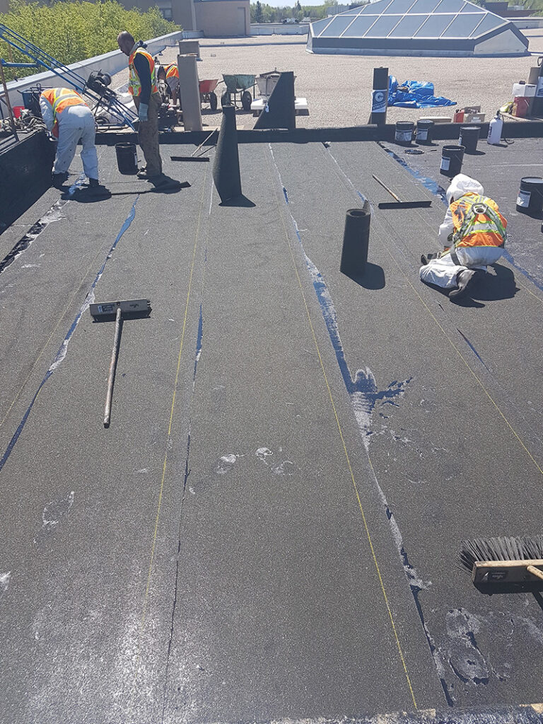 Roofing crew working during installation